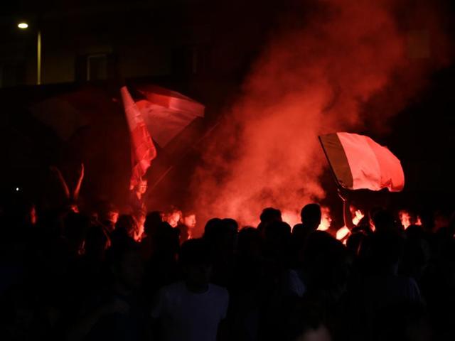 Supporters in Rome light flares after Italy scored, as they watched the live broadcast of the Euro 2016 quarterfinal match between Italy and Germany. (AP Photo) 