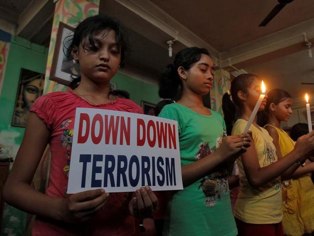 Students at a vigil for the victims of Friday’s attack in Dhak, in Agartala on Sunday.(REUTERS)