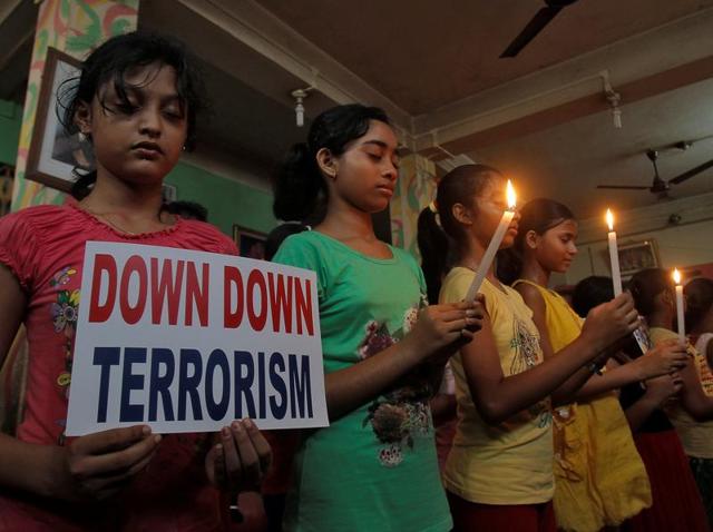 People gather to pay candle light tribute and show solidarity with the victims of the terrorist attack at a cafe of Dhaka. (PTI) People gather to pay candle light tribute and show solidarity with the victims of the terrorist attack at a cafe of Dhaka. (PTI)