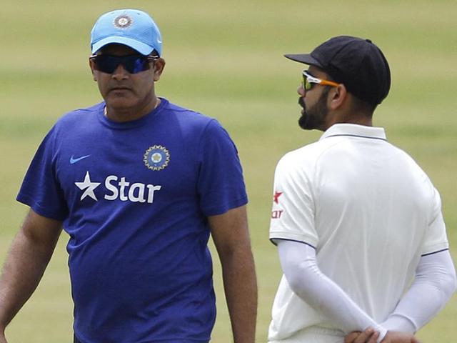 Indian cricket team captain Virat Kohli, right, and head coach Anil Kumble walk past each other. (AP Photo) Indian cricket team captain Virat Kohli, right, and head coach Anil Kumble walk past each other. (AP Photo)