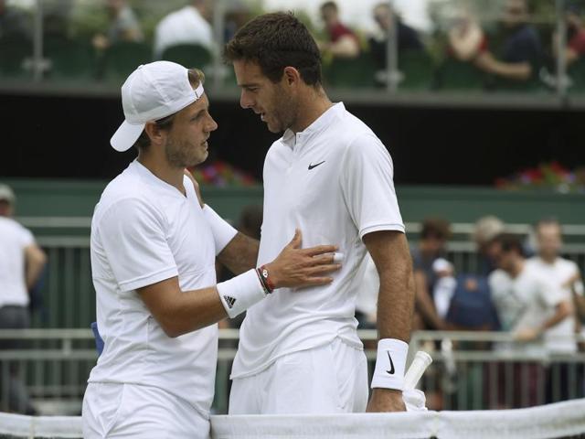 France's Lucas Pouille embraces Argentina's Juan Martin Del Potro after winning their match. (REUTERS)