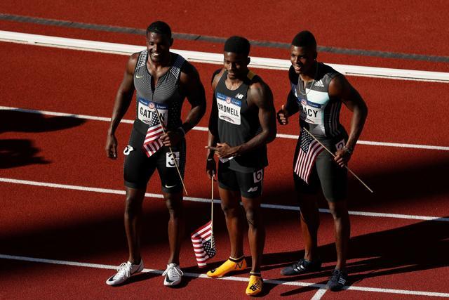 From left to right: Justin Gatlin, first, Trayvon Bromell, second, and Marvin Bracy, third, pose together after the men's 100m final during the US Olympic trials. (AFP) From left to right: Justin Gatlin, first, Trayvon Bromell, second, and Marvin Bracy, third, pose together after the men's 100m final during the US Olympic trials. (AFP)