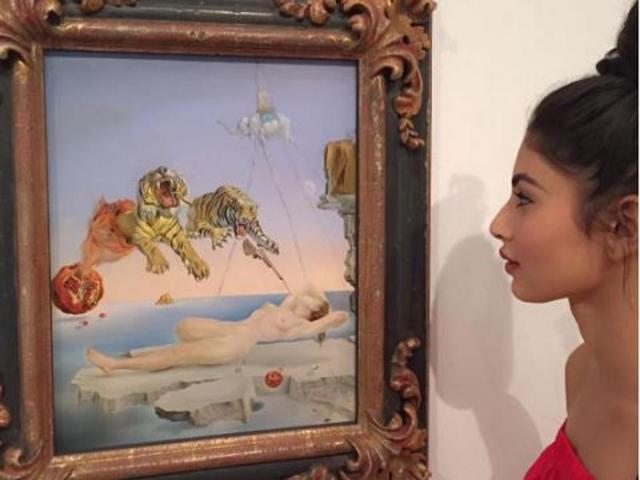 TV star Mouni Roy appreciating a Salvador Dali painting, Dream Caused by the Flight of a Bee Around a Pomegranate a Second Before Awakening. (Instagram) 