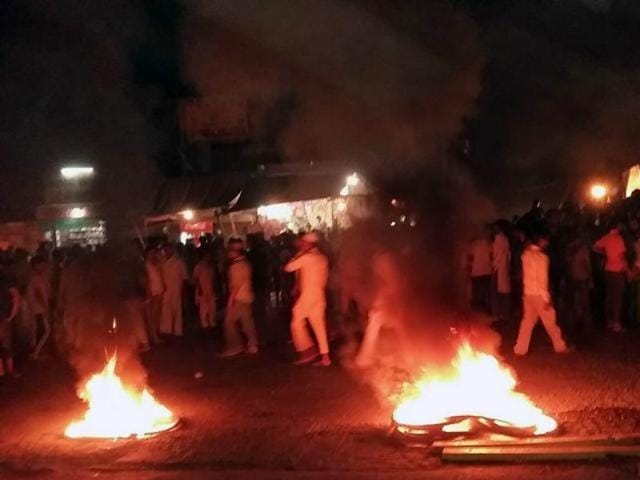 A mob set some vehicles afire and damaged property of an MLA after some pages of the Quran were found torn outside a cemetery in Malerkotla. (HT Photo) A mob set some vehicles afire and damaged property of an MLA after some pages of the Quran were found torn outside a cemetery in Malerkotla. (HT Photo)
