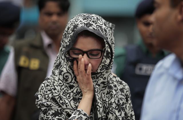 An unidentified relative of one of the victims of the attack on Holey Artisan Bakery reacts as people pay tribute to the deceased, at a stadium in Dhaka.(AP) An unidentified relative of one of the victims of the attack on Holey Artisan Bakery reacts as people pay tribute to the deceased, at a stadium in Dhaka.(AP)