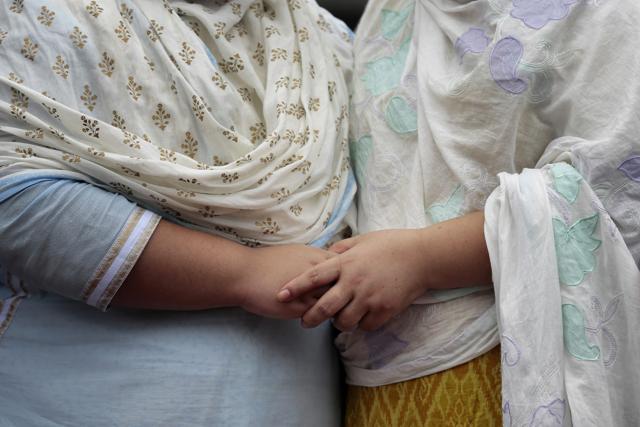 Unidentified relatives of Bangladeshi victims of the attack on Holey Artisan Bakery react as people pay tribute to the deceased, at a stadium in Dhaka. (AP) Unidentified relatives of Bangladeshi victims of the attack on Holey Artisan Bakery react as people pay tribute to the deceased, at a stadium in Dhaka. (AP)