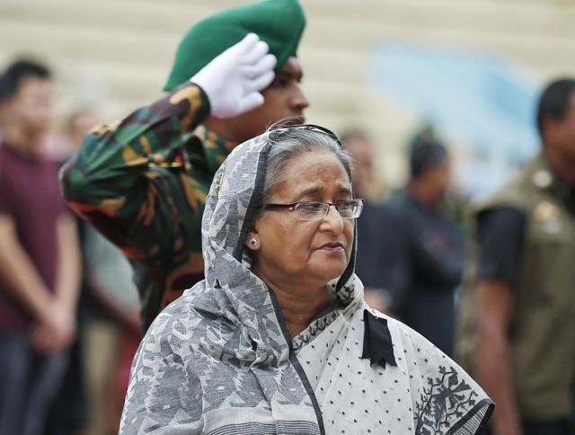 Bangladeshs Prime Minister Sheikh Hasina offers her tribute to the victims of the attack on Holey Artisan Bakery, at a stadium in Dhaka. (AP) Bangladeshs Prime Minister Sheikh Hasina offers her tribute to the victims of the attack on Holey Artisan Bakery, at a stadium in Dhaka. (AP)