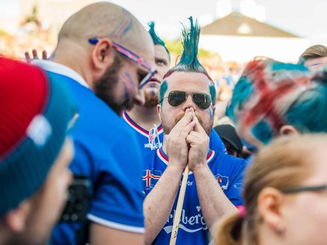 Iceland's  blue mohawk  fans react as  Iceland finish with an ‘icy’ stop at the Euro 2016. (AFP PHOTO) 