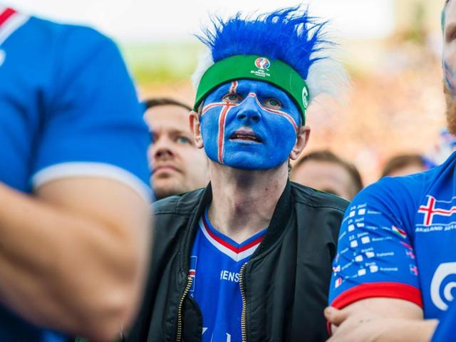 Iceland's fans react  with disappointment  over their crippling loss. (AFP photo) 
