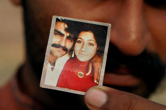 Mohammed Tofeeq shows a picture with his wife Muqadas Tofeeq, who local police say was killed by her mother, in Butrawala village on the outskirts of Gujranwala, Pakistan. (AP Photo) Mohammed Tofeeq shows a picture with his wife Muqadas Tofeeq, who local police say was killed by her mother, in Butrawala village on the outskirts of Gujranwala, Pakistan. (AP Photo)