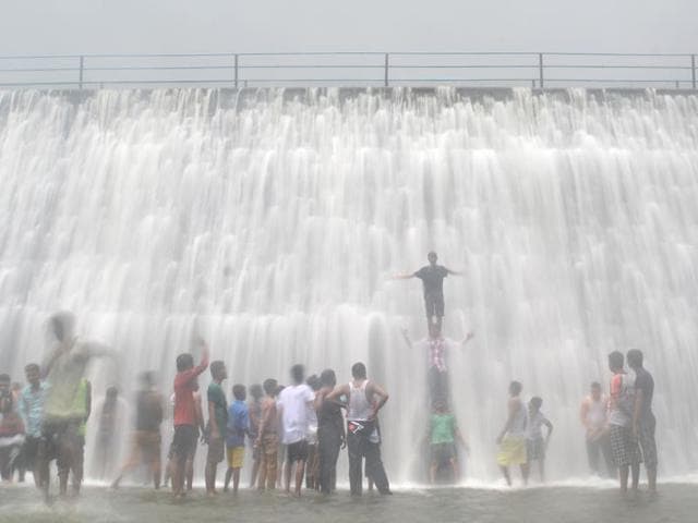 The Powai lake overflows on Sunday. (Prashant Waydande) The Powai lake overflows on Sunday. (Prashant Waydande)