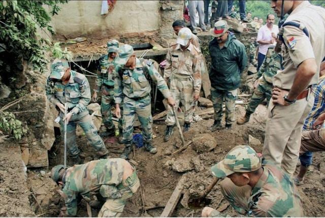 Indian Army and SDRF troops carry out rescue and relief works. (PTI) Indian Army and SDRF troops carry out rescue and relief works. (PTI)
