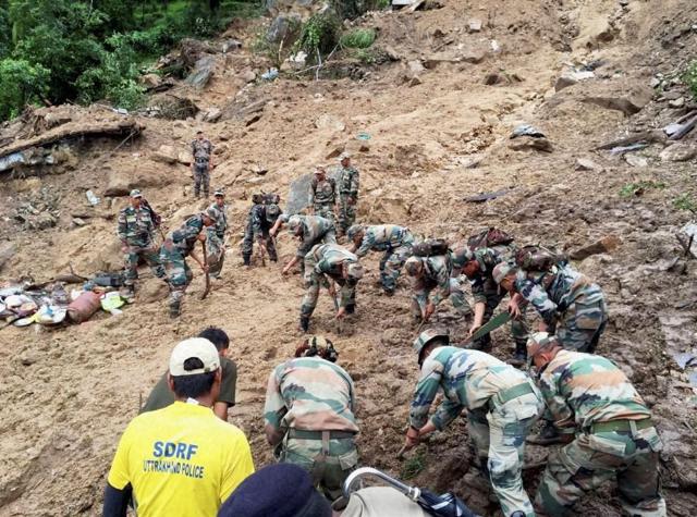 Indian Army and SDRF troops carry out rescue and relief works. (PTI) Indian Army and SDRF troops carry out rescue and relief works. (PTI)