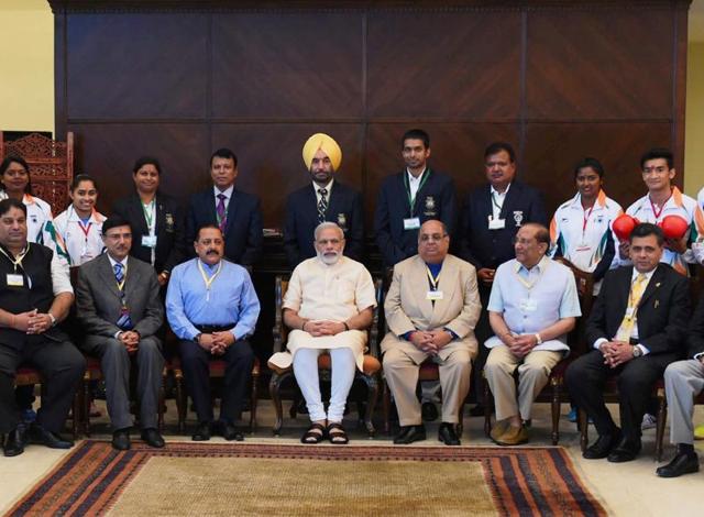 Prime Minister Narendra Modi and Minister of State for Youth Affairs and Sports, Jitendra Singh in a group photograph. (PTI photo) Prime Minister Narendra Modi and Minister of State for Youth Affairs and Sports, Jitendra Singh in a group photograph. (PTI photo)