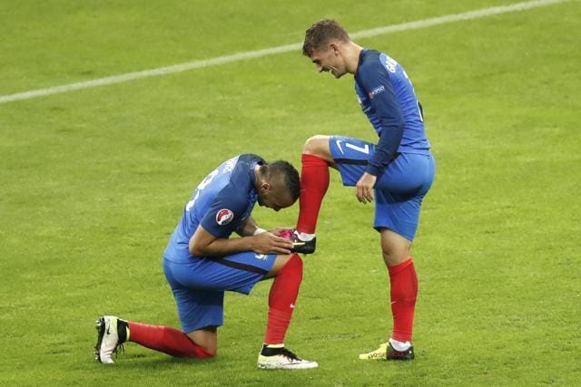 France's Antoine Griezmann r(ight) celebrates after scoring his side's fourth goal with teammate Dimitri Payet (left) during the Euro 2016 quarterfinal match against Iceland. (AP Photo)