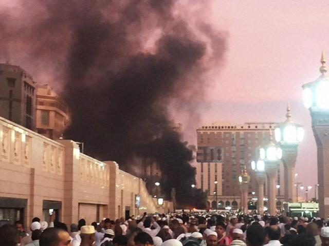 Muslim worshippers gather after a suicide bomber detonated a device near the security headquarters of the Prophet's Mosque in Medina, Saudi Arabia, on Monday.. (Reuters) Muslim worshippers gather after a suicide bomber detonated a device near the security headquarters of the Prophet's Mosque in Medina, Saudi Arabia, on Monday.. (Reuters)