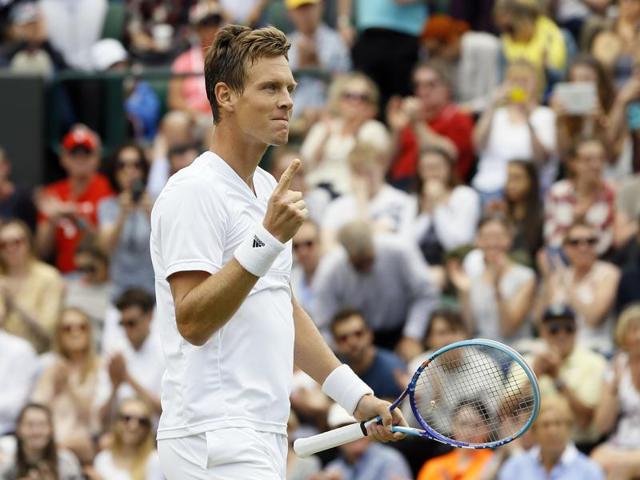 Tomas Berdych of the Czech Republic celebrates after defeating countryman Jiri Vesely in five sets to book his quarterfinal berth. (AP)