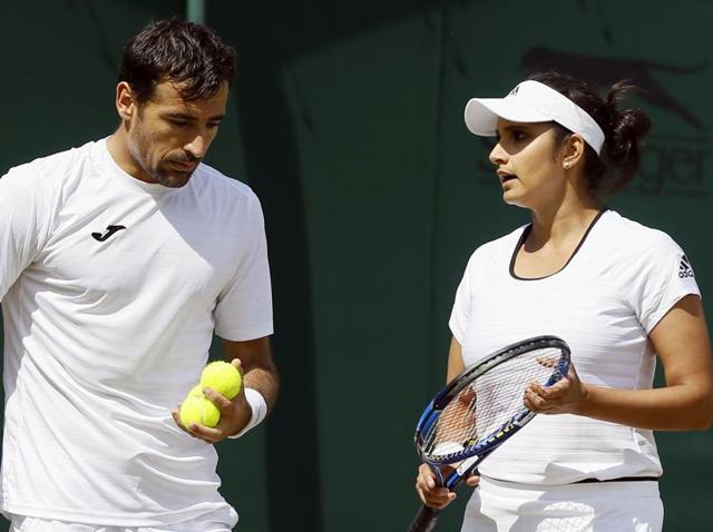 Sania Mirza throws her racquet after losing a point. (AFP) Sania Mirza throws her racquet after losing a point. (AFP)