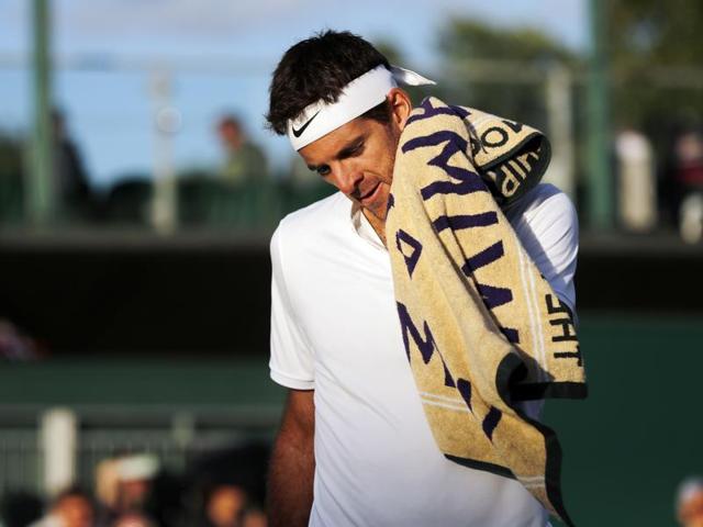 Juan Martin del Potro of Argentina wipes his face during his men's singles match against Lucas Pouille of France on day six of the Wimbledon Tennis Championships in London. (AP Photo) Juan Martin del Potro of Argentina wipes his face during his men's singles match against Lucas Pouille of France on day six of the Wimbledon Tennis Championships in London. (AP Photo)