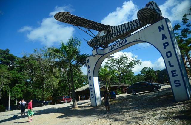 People pose for pictures at the entrance of the Hacienda Napoles theme park, once the private zoo of drug kingpin Pablo Escobar at his Napoles ranch. (AFP) People pose for pictures at the entrance of the Hacienda Napoles theme park, once the private zoo of drug kingpin Pablo Escobar at his Napoles ranch. (AFP)