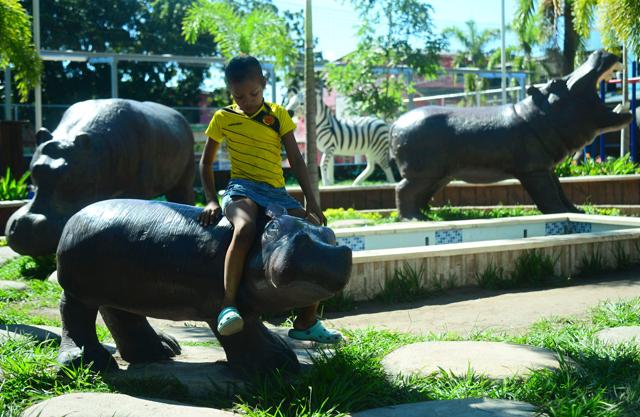 A boy sits on a hippo model at Jorge Tulio Garces neighbourhood in Doradal, Antioquia department, Colombia, near the Hacienda Napoles theme park. (AFP) A boy sits on a hippo model at Jorge Tulio Garces neighbourhood in Doradal, Antioquia department, Colombia, near the Hacienda Napoles theme park. (AFP)