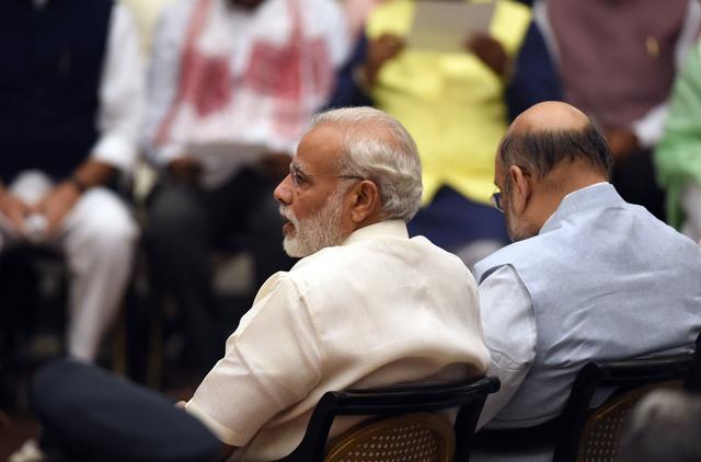 Indian Prime Minister Narendra Modi attends the swearing-in ceremony of new cabinet ministers . PM Modi revamped his cabinet bringing in 19 new junior ministers to speed up decision-making and delivery on promises made in this year's budget. (AFP) Indian Prime Minister Narendra Modi attends the swearing-in ceremony of new cabinet ministers . PM Modi revamped his cabinet bringing in 19 new junior ministers to speed up decision-making and delivery on promises made in this year's budget. (AFP)