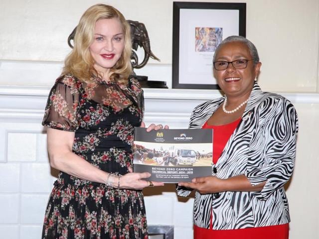 Singer-songwriter Madonna poses for a photograph with Kenyan First Lady Margaret Kenyatta as she receives a Beyond Zero campaign technical report at State House in Nairobi, Kenya, July 4, 2016. (REUTERS) Singer-songwriter Madonna poses for a photograph with Kenyan First Lady Margaret Kenyatta as she receives a Beyond Zero campaign technical report at State House in Nairobi, Kenya, July 4, 2016. (REUTERS)