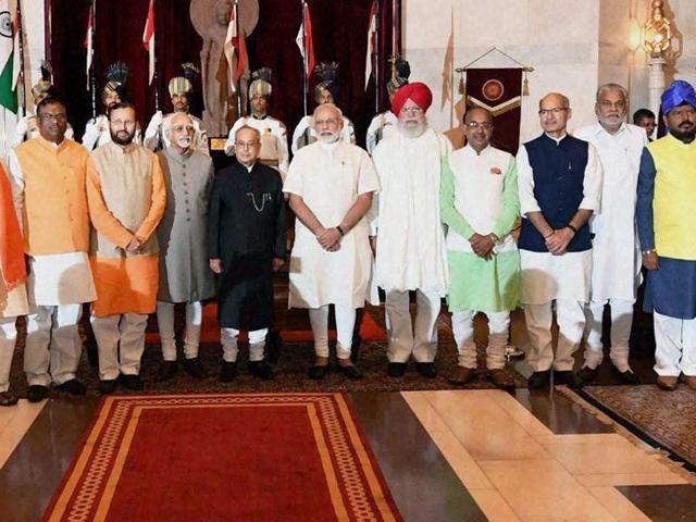 President Pranab Mukherjee, vice-president Hamid Ansari and Prime Minister Narendra Modi with the newly sworn-in ministers at Rashtrapati Bhavan in New Delhi.(PTI) President Pranab Mukherjee, vice-president Hamid Ansari and Prime Minister Narendra Modi with the newly sworn-in ministers at Rashtrapati Bhavan in New Delhi.(PTI)
