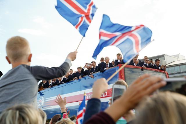 Iceland fans celebrate as their national team comes home to a hero's welcome from the Euro 2016, in Reykjavik. (AP Photo)