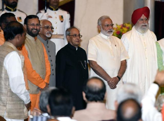 President Pranab Mukherjee, Prime Minister Narendra Modi and vice-president Hamid Ansari with newly inducted ministers at the Rashtrapati Bhavan.(Sonu Mehta/ HT Photo) President Pranab Mukherjee, Prime Minister Narendra Modi and vice-president Hamid Ansari with newly inducted ministers at the Rashtrapati Bhavan.(Sonu Mehta/ HT Photo)
