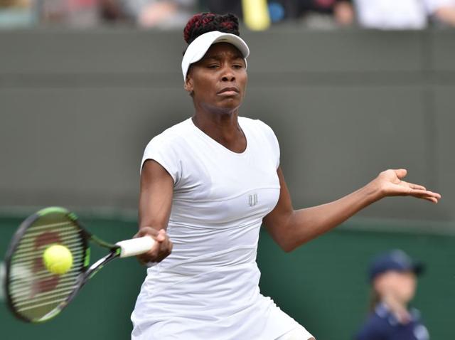 US player Venus Williams returns against Spain's Carla Suarez Navarro during their women's singles fourth round match on the eighth day of the 2016 Wimbledon Championships at The All England Lawn Tennis Club in Wimbledon, southwest London. (AFP Photo) US player Venus Williams returns against Spain's Carla Suarez Navarro during their women's singles fourth round match on the eighth day of the 2016 Wimbledon Championships at The All England Lawn Tennis Club in Wimbledon, southwest London. (AFP Photo)