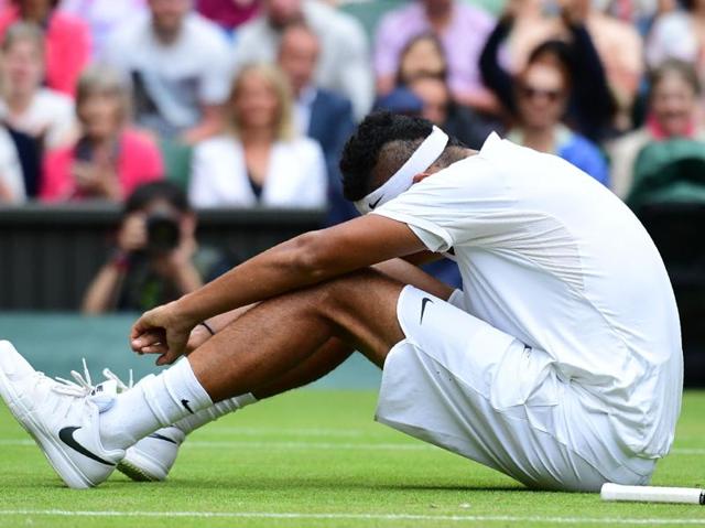Australia's Nick Kyrgios sits on court after falling while playing Andy Murray during their men's singles fourth round match on the eighth day of the 2016 Wimbledon Championships at The All England Lawn Tennis Club in Wimbledon. (AFP Photo) Australia's Nick Kyrgios sits on court after falling while playing Andy Murray during their men's singles fourth round match on the eighth day of the 2016 Wimbledon Championships at The All England Lawn Tennis Club in Wimbledon. (AFP Photo)