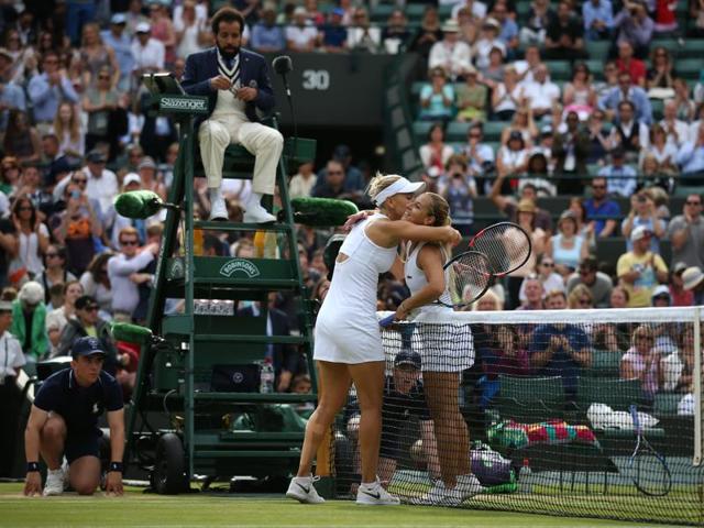 Vesnina (L) and Dominika Cibulkova embrace at the net after the match. (AFP)