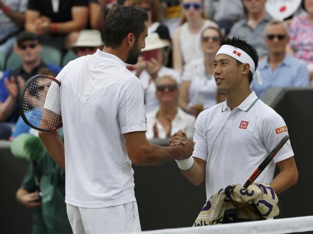 Japan's Kei Nishikori with Croatia's Marin Cilic after retiring during the match due to injury. (Reuters Photo) Japan's Kei Nishikori with Croatia's Marin Cilic after retiring during the match due to injury. (Reuters Photo)