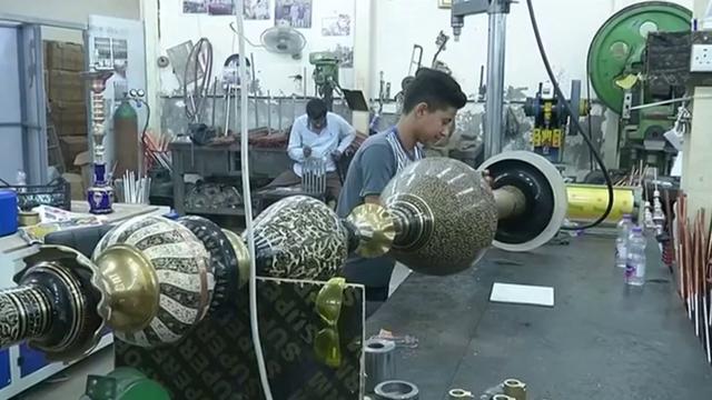<p>An Iraqi shisha factory has made a massive 11.5ft nargileh, which it hopes will break world records for being the biggest of its kind. They're known for making the traditional Babylonian shisha, which is very popular in Iraq. This massive hookah is made out of pure copper with oriental decorations engraved by hand. It may not be very hard to smoke from it but it is difficult to get it cleaned. In fact, workers climb on ladders to clean and change the coal, each time.</p>