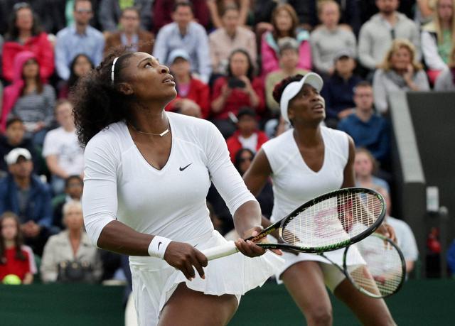 Serena Williams (left) and her sister Venus watch the ball during their women's doubles match against Andreja Klepac and Katarina Srebotnik of Slovenia. (AP Photo) Serena Williams (left) and her sister Venus watch the ball during their women's doubles match against Andreja Klepac and Katarina Srebotnik of Slovenia. (AP Photo)