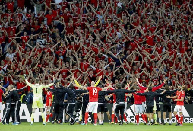 Wales' players celebrate with fans their 3-1 win at the end of the Euro 2016 quarterfinal match against Belgium, at the Pierre Mauroy stadium in Villeneuve d’Ascq, near Lille, France. (AP File Photo) Wales' players celebrate with fans their 3-1 win at the end of the Euro 2016 quarterfinal match against Belgium, at the Pierre Mauroy stadium in Villeneuve d’Ascq, near Lille, France. (AP File Photo)