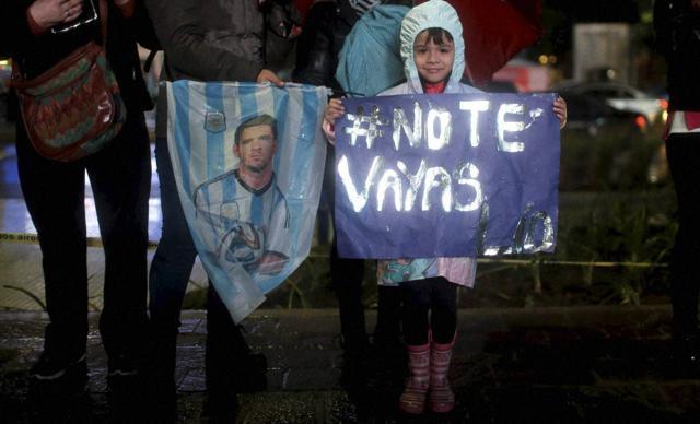 Buenos Aires : A girl holds a banner that shows a Spanish hastag Lio dont leave as Lionel Messi fans gather to show him their support in Buenos Aires, Argentina. (AP Photo) Buenos Aires : A girl holds a banner that shows a Spanish hastag Lio dont leave as Lionel Messi fans gather to show him their support in Buenos Aires, Argentina. (AP Photo)