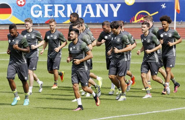Players run during a training session of the German national football team at their base camp in Evian-Les-Bains, France. (AP Photo)