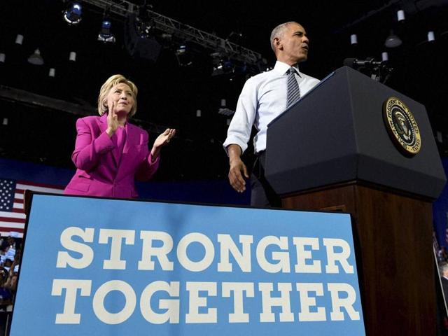 President Barack Obama and Democratic presidential candidate Hillary Clinton wave following a campaign event in Charlotte, North Carolina, on Tuesday. (AP) President Barack Obama and Democratic presidential candidate Hillary Clinton wave following a campaign event in Charlotte, North Carolina, on Tuesday. (AP)