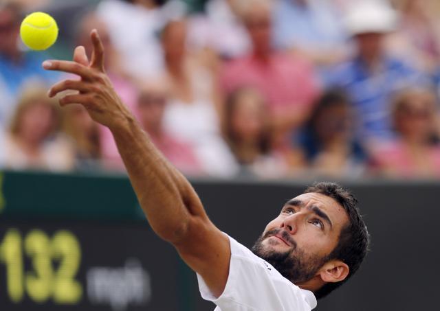 Marin Cilic of Croatia serves to Kei Nishikori of Japan during their men's singles match on day eight of the Wimbledon Tennis Championships in London. (AP Photo) Marin Cilic of Croatia serves to Kei Nishikori of Japan during their men's singles match on day eight of the Wimbledon Tennis Championships in London. (AP Photo)