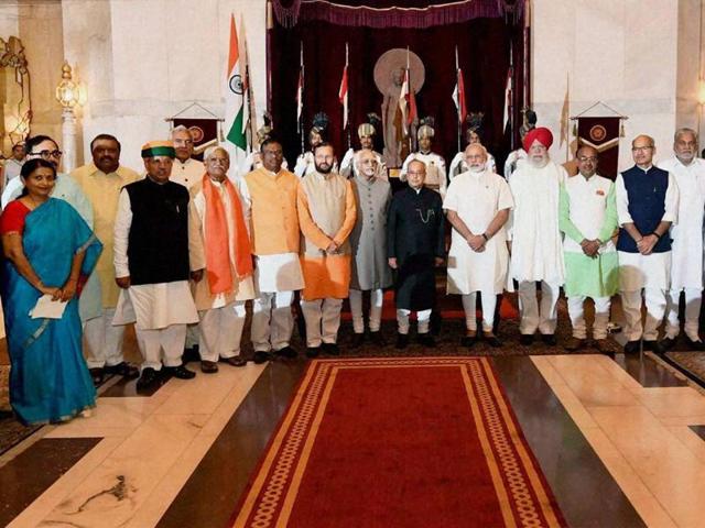President Pranab Mukherjee, vice-president Hamid Ansari and Prime Minister Narendra Modi with the newly sworn-in ministers at the oath-taking ceremony at Rashtrapati Bhavan in New Delhi.(PTI)
