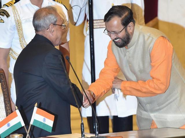 President Pranab Mukherjee greets Prakash Javadekar after administering the oath of office to him as a cabinet minister during a swearing-in ceremony at Rashtrapati Bhavan in New Delhi on Tuesday. (PTI) President Pranab Mukherjee greets Prakash Javadekar after administering the oath of office to him as a cabinet minister during a swearing-in ceremony at Rashtrapati Bhavan in New Delhi on Tuesday. (PTI)