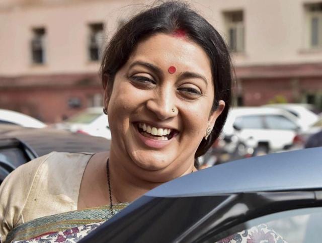 Bharatiya Janata Party legislator Smriti Irani leaves her office after taking charge of the textiles ministry in New Delhi on Wednesday.(PTI)