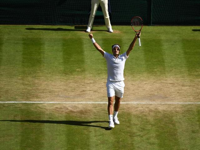 Switzerland's Roger Federer celebrates defeating Croatia's Marin Cilic in their men's singles quarter-final at Wimbledon on July 6, 2016. Federer won 6-7 (4), 4-6, 6-3, 7-6 (9), 6-3. (AFP)