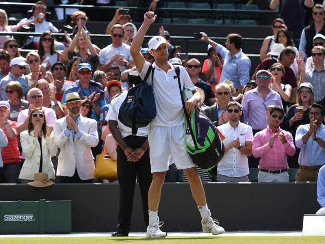 Sam Querrey walks off court after losing to Milos Raonic. (AFP)