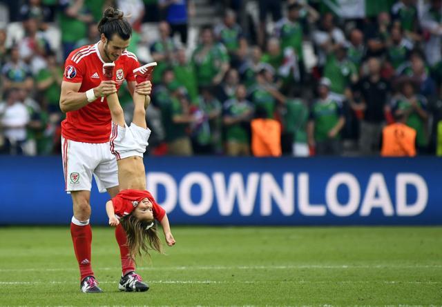 Wales' forward Gareth Bale holds his daughter Alba Viola following the Euro 2016 round of sixteen football match Wales vs Northern Ireland, at the Parc des Princes stadium in Paris. (AFP Photo) Wales' forward Gareth Bale holds his daughter Alba Viola following the Euro 2016 round of sixteen football match Wales vs Northern Ireland, at the Parc des Princes stadium in Paris. (AFP Photo)