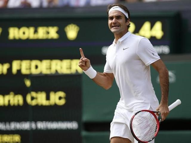 Federer celebrates winning the fourth set. (Reuters)