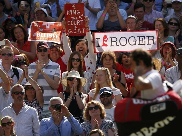 Federer fans cheer as the Swiss walks off court. (REUTERS)