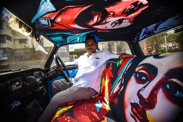 One of the first hand-painted taxis featuring Bollywood posters One of the first hand-painted taxis featuring Bollywood posters